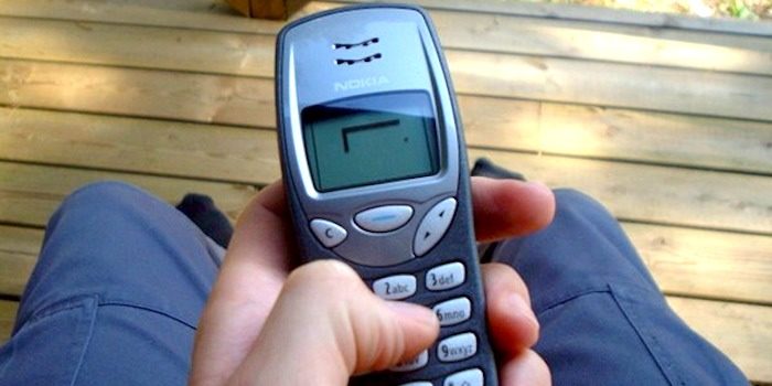 A person plays the classic mobile game Snake as the new Nokia 3310